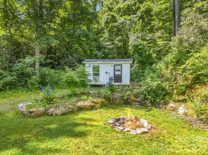 216 Aiken Road, Rosman, NC 28772.  MLS# CAR4401151, YatesRealty ID 36839. Tiny home on the property