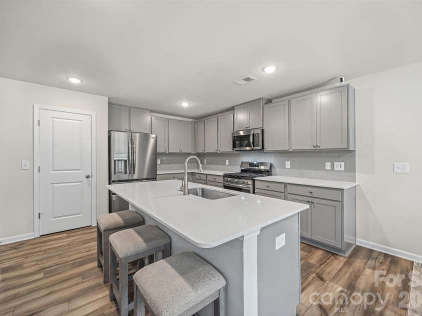 1183 Blackburn Circle, Edgemoor, SC 29712.  MLS# CAR4403052, YatesRealty ID 36856. Open kitchen with island