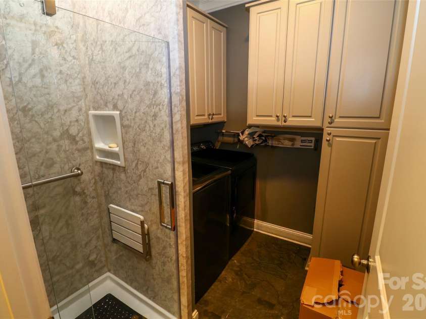 109 Americana Drive, Mooresville, NC 28115.  MLS# CAR4399467, YatesRealty ID 36861. Laundry room with additional shower.