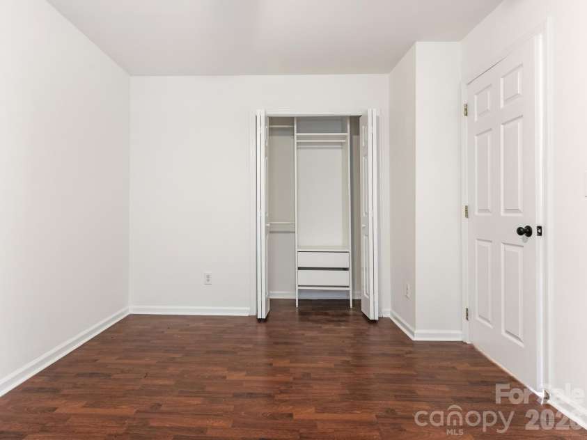 2940 Hosta Drive, Charlotte, NC 28269.  MLS# CAR4398413, YatesRealty ID 36862. Flex room 3rd Bedroom offers dedicated space for home office, hobby work, or creative projects. Separated from main living with natural light—a real workspace.