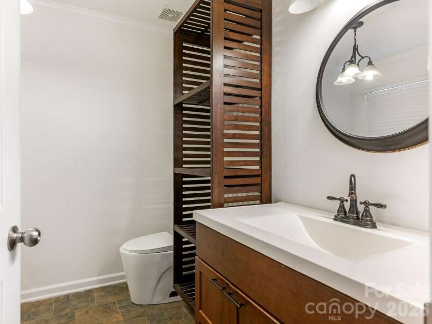 2940 Hosta Drive, Charlotte, NC 28269.  MLS# CAR4398413, YatesRealty ID 36862. Updated full bath with modern fixtures. Clean and functional—a practical daily-use space that works well.