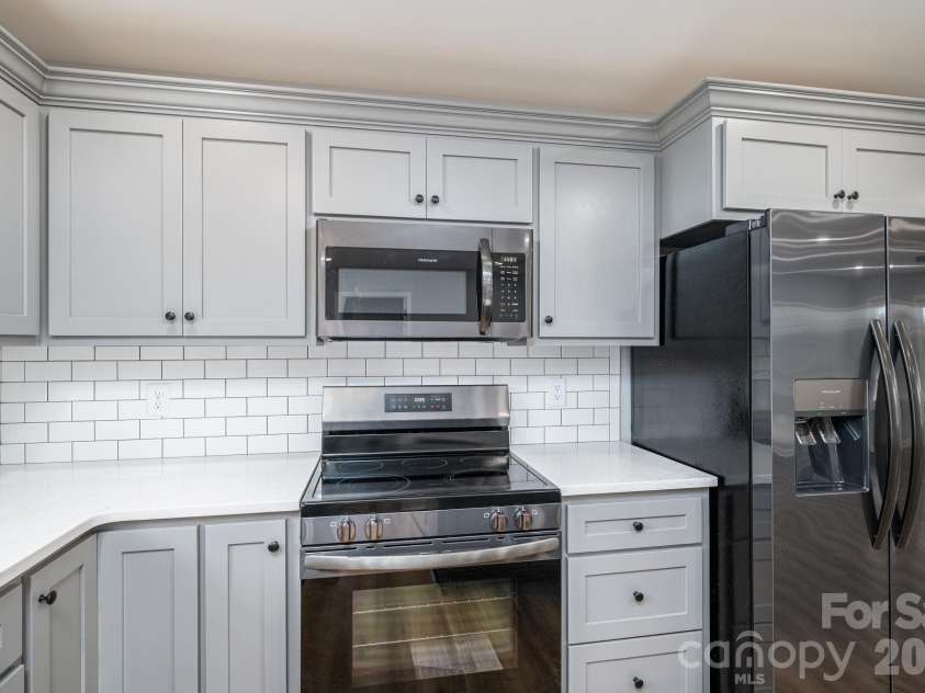 307 Northbrook III School Road, Vale, NC 28168.  MLS# CAR4403635, YatesRealty ID 36876. Kitchen Range/Fridge