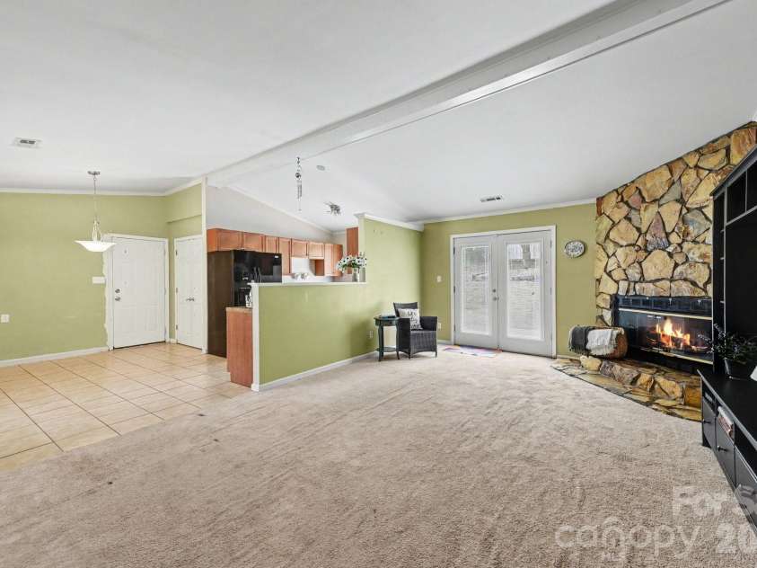 6200 Dwightware Boulevard, Charlotte, NC 28227.  MLS# CAR4403876, YatesRealty ID 36883. Open floor plan - view shows living room, kitchen and dining area