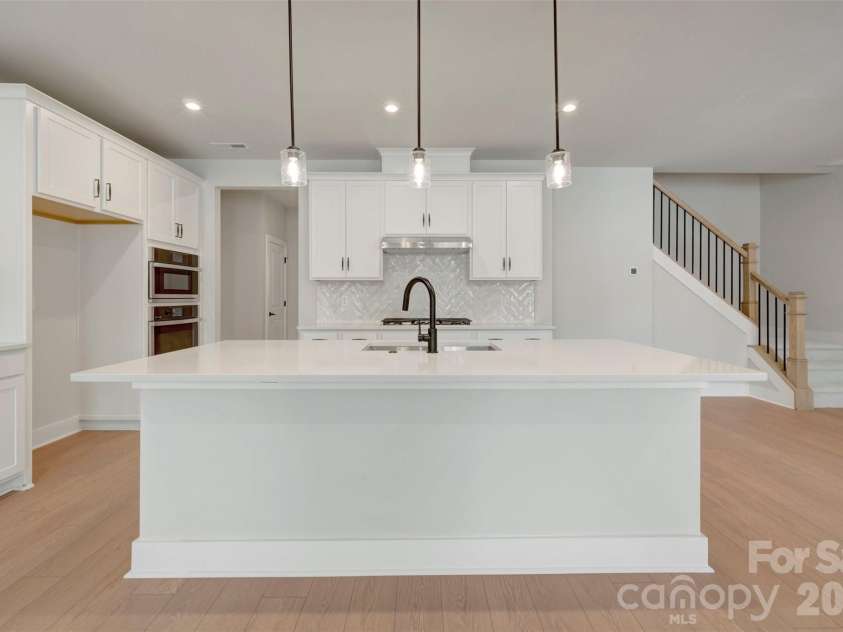 314 Ardmore Drive, Belmont, NC 28012.  MLS# CAR4404249, YatesRealty ID 36893. Kitchen with white cabinets and white quartz countertops