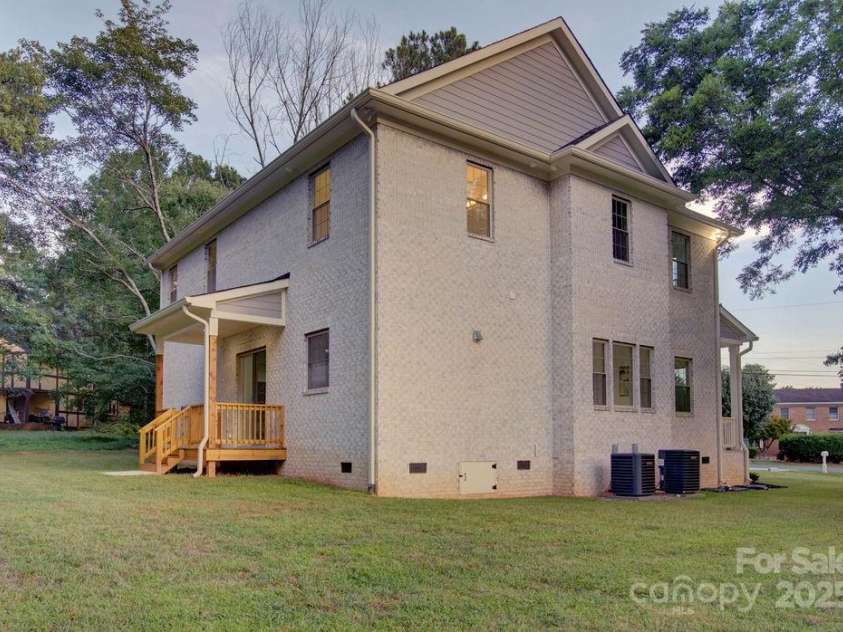5125 Isaac Drive, Charlotte, NC 28216.  MLS# CAR4281649, YatesRealty ID 3693. Back covered porch