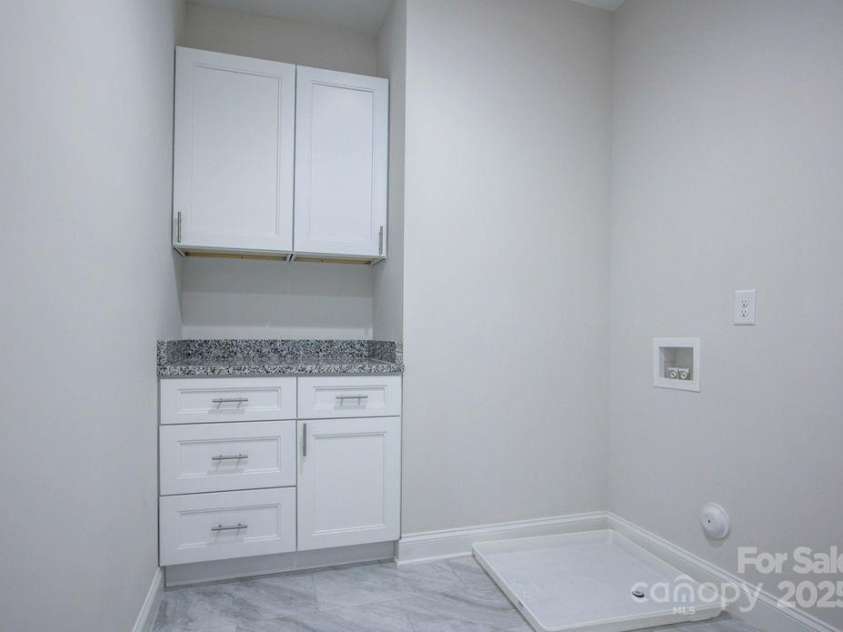 5125 Isaac Drive, Charlotte, NC 28216.  MLS# CAR4281649, YatesRealty ID 3693. Upstairs laundry