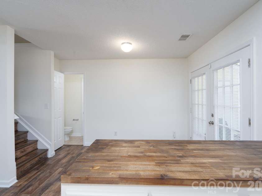 6491 Saint Bernard Way, Charlotte, NC 28269.  MLS# CAR4400216, YatesRealty ID 36939. Kitchen/Stairs
