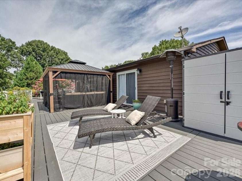 21416 Verano Place, Cornelius, NC 28031.  MLS# CAR4378755, YatesRealty ID 36940. Deck Lounge Area off Master bedroom