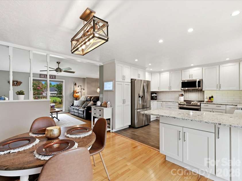 21416 Verano Place, Cornelius, NC 28031.  MLS# CAR4378755, YatesRealty ID 36940. Kitchen and Great room