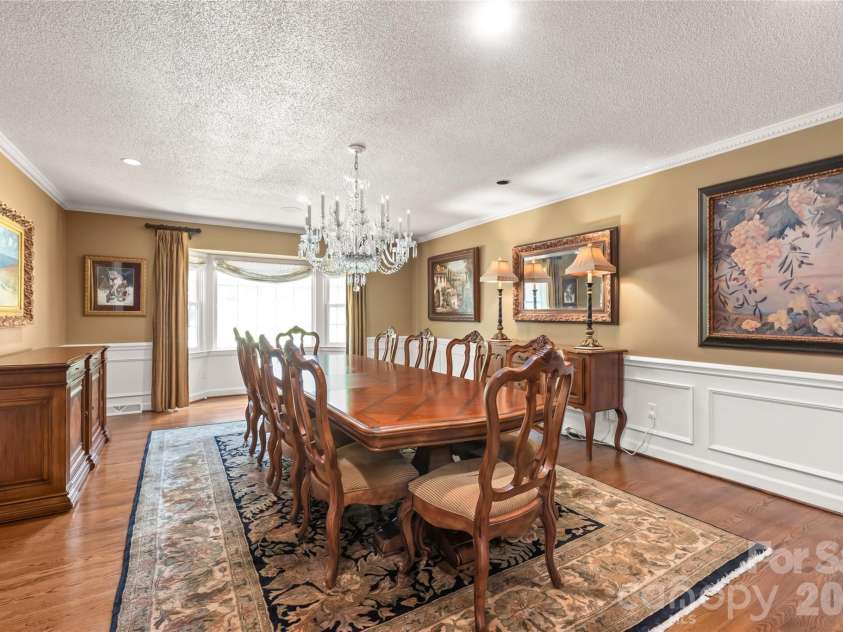 301 Fairway Drive, Fort Mill, SC 29715.  MLS# CAR4400681, YatesRealty ID 36942. Highlighted by a stunning bay window, this large dining room easily accommodates a table for 10+...perfect for holiday gatherings and dinner parties.