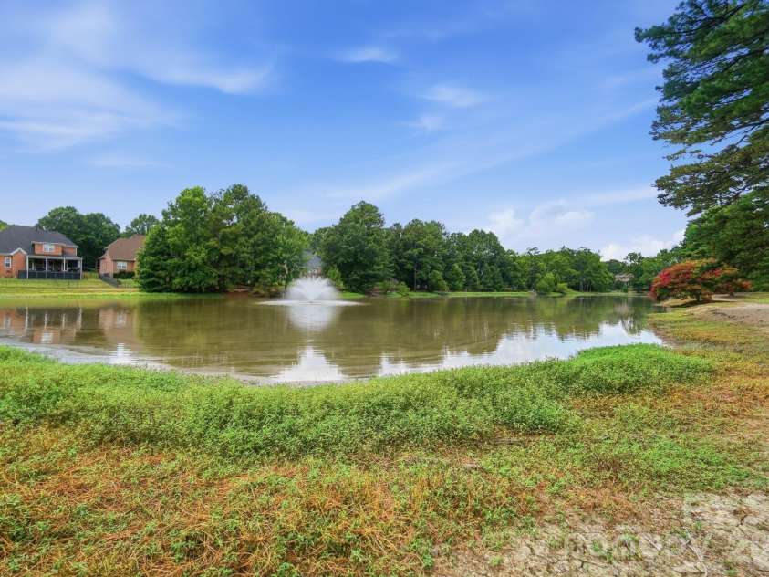 6017 Colton Ridge Drive, Indian Trail, NC 28079.  MLS# CAR4401537, YatesRealty ID 36949. Community Pond