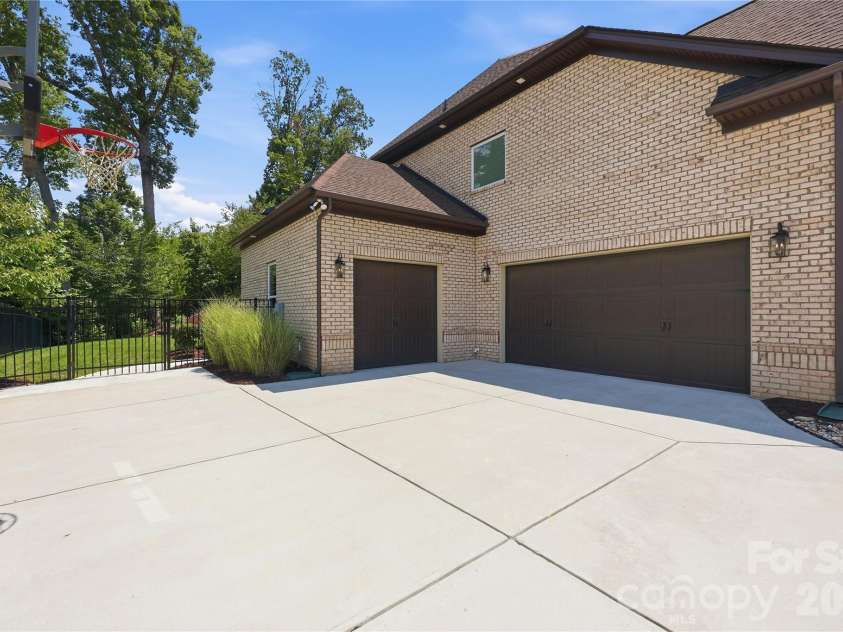 18314 Doves Crest Road, Cornelius, NC 28031.  MLS# CAR4397375, YatesRealty ID 36956. 3 car garage configuration with ample driveway parking