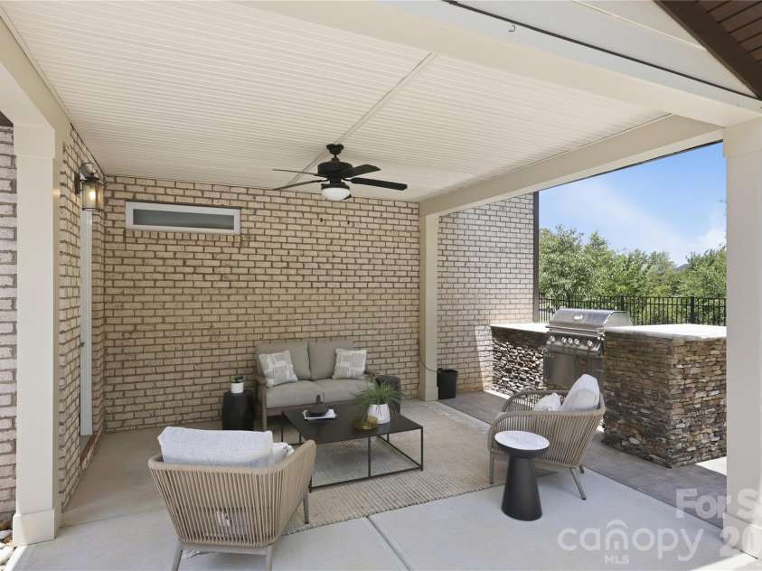 18314 Doves Crest Road, Cornelius, NC 28031.  MLS# CAR4397375, YatesRealty ID 36956. Covered patio area with built in grill