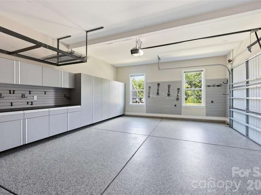 18314 Doves Crest Road, Cornelius, NC 28031.  MLS# CAR4397375, YatesRealty ID 36956. Custom storage in the 2 car garage with epoxy flooring