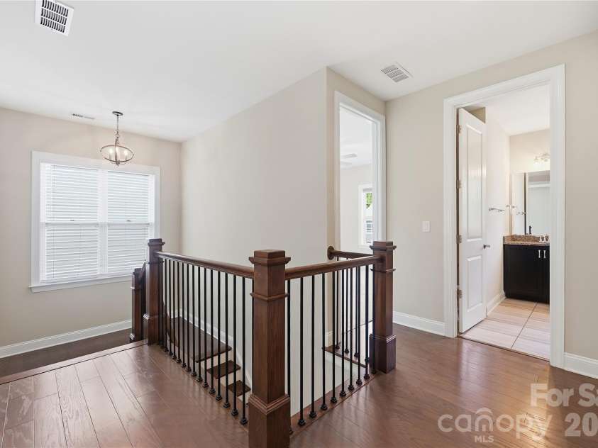 18314 Doves Crest Road, Cornelius, NC 28031.  MLS# CAR4397375, YatesRealty ID 36956. Engineered hardwoods continue upstairs to the hallway