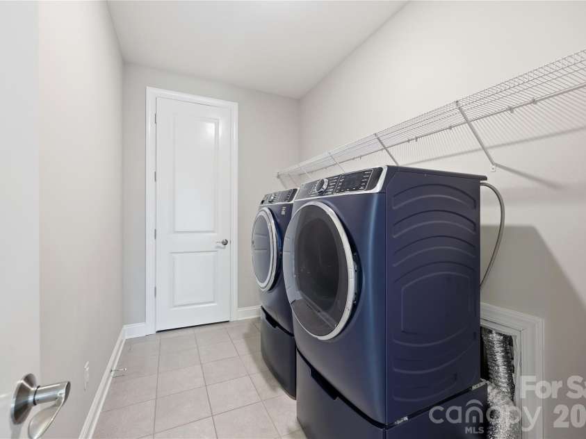 18314 Doves Crest Road, Cornelius, NC 28031.  MLS# CAR4397375, YatesRealty ID 36956. Laundry room located upstairs