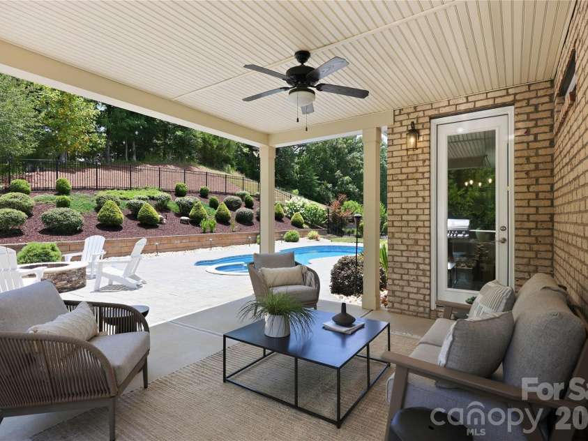 18314 Doves Crest Road, Cornelius, NC 28031.  MLS# CAR4397375, YatesRealty ID 36956. Patio area overlooks the fabulous backyard and is accessed off the kitchen