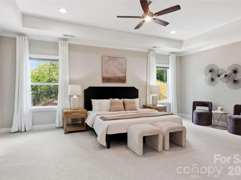 18314 Doves Crest Road, Cornelius, NC 28031.  MLS# CAR4397375, YatesRealty ID 36956. Primary suite is spacious and serene