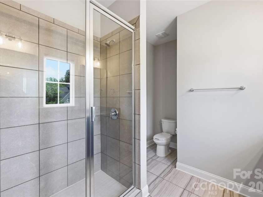 18314 Doves Crest Road, Cornelius, NC 28031.  MLS# CAR4397375, YatesRealty ID 36956. With walk in shower