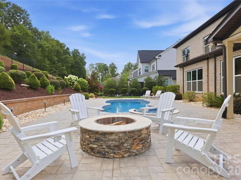 18314 Doves Crest Road, Cornelius, NC 28031.  MLS# CAR4397375, YatesRealty ID 36956. Wood burning firepit