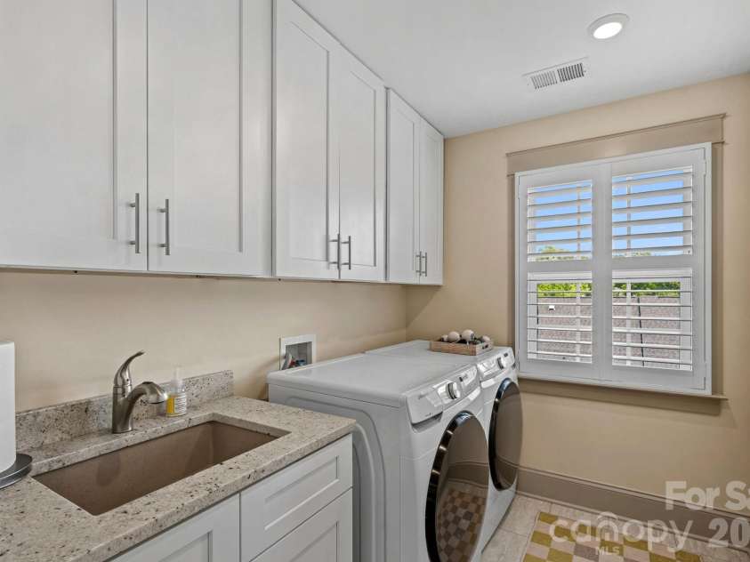 473 Main Street, Davidson, NC 28036.  MLS# CAR4403660, YatesRealty ID 36959. Top Level Laundry Room with Sink
