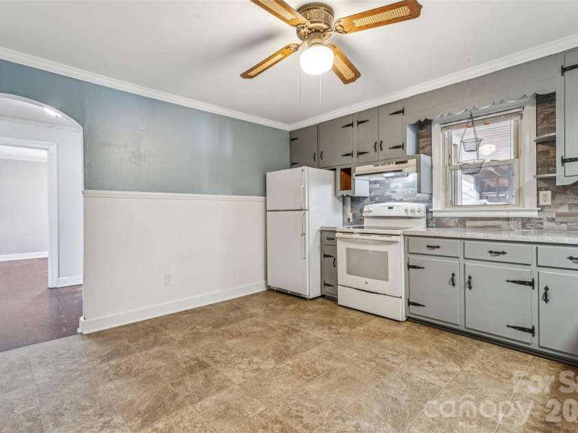 5650 Bertie Avenue, Salisbury, NC 28147.  MLS# CAR4346042, YatesRealty ID 3696. Kitchen looking back to hall & bedrooms