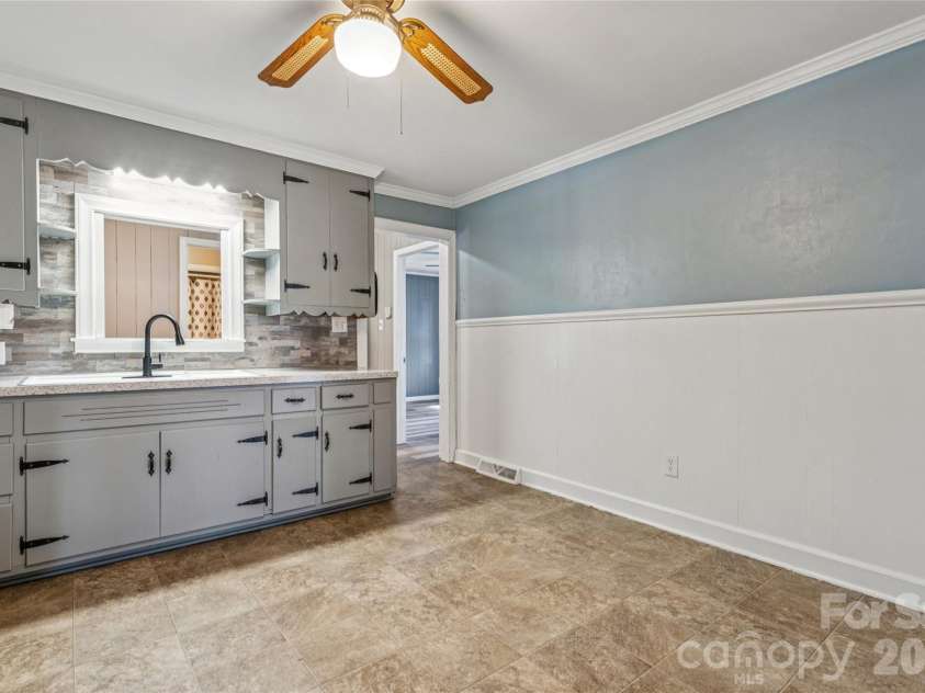 5650 Bertie Avenue, Salisbury, NC 28147.  MLS# CAR4346042, YatesRealty ID 3696. Kitchen looking to hall & primary bedroom