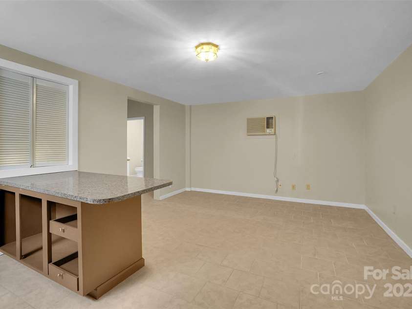 7921 Fairmont Drive, Waxhaw, NC 28173.  MLS# CAR4220531, YatesRealty ID 3697. Guest house living rm