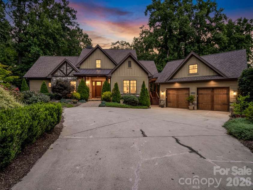 153 Glenn Court, Mill Spring, NC 28756.  MLS# CAR4404140, YatesRealty ID 36970. Twilight AI Generated