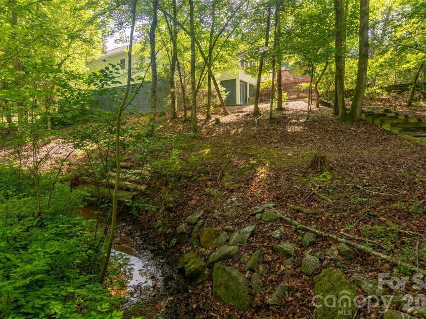 30 Brookside Drive, Columbus, NC 28722.  MLS# CAR4402139, YatesRealty ID 36972. Creek