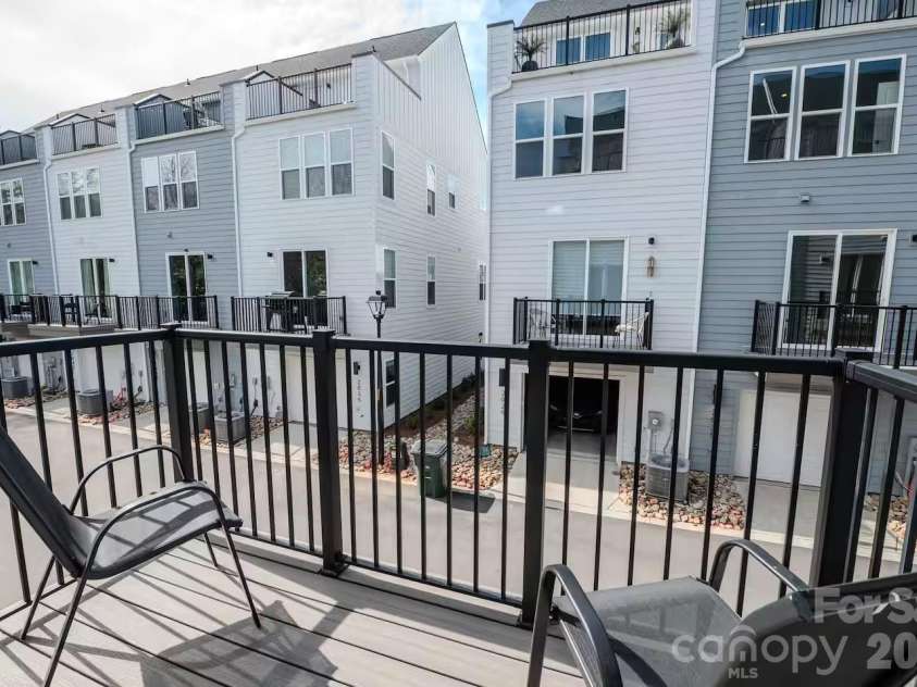 3023 Jolene Court, Charlotte, NC 28206.  MLS# CAR4399179, YatesRealty ID 36983. Step outside to a private balcony, the perfect spot to enjoy your morning coffee, unwind in the evening, or take in the surrounding neighborhood views.