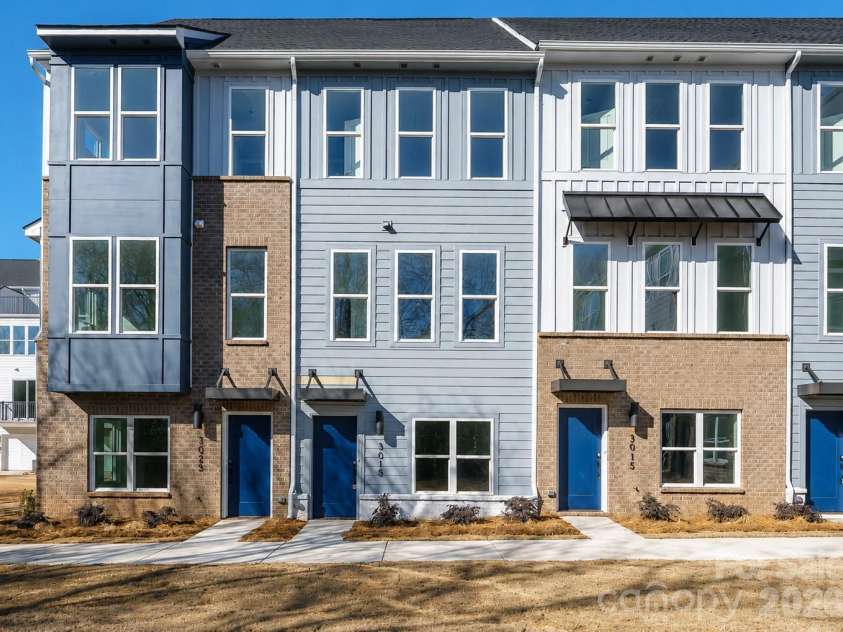 3019 Jolene Court, Charlotte, NC 28206.  MLS# CAR4399234, YatesRealty ID 36984. Modern four-level townhome featuring striking contemporary architecture, low-maintenance exterior finishes, and a prime Charlotte location close to shopping, dining, entertainment, and major commuter routes.