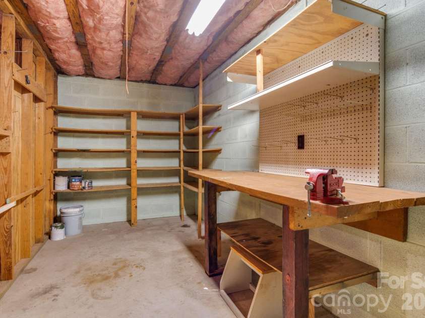 423 Rambling Drive, Hendersonville, NC 28739.  MLS# CAR4403347, YatesRealty ID 36988. Basement Work Room