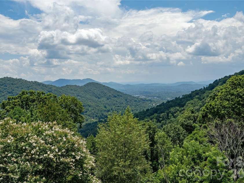 811 Town Mountain Road, Asheville, NC 28804.  MLS# CAR4401044, YatesRealty ID 36993. Summer view from the deck