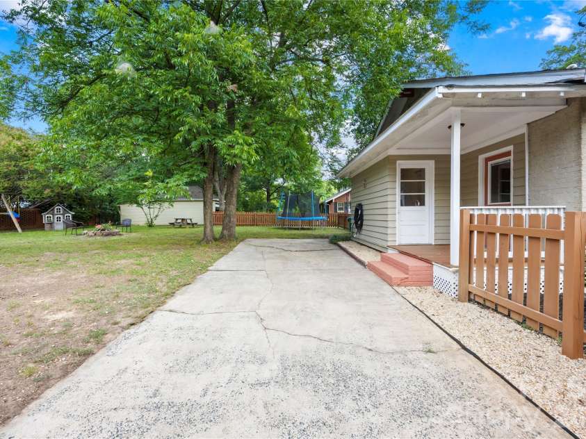 218 Winburn Street, Monroe, NC 28112.  MLS# CAR4399866, YatesRealty ID 36999. Driveway is off of the side street and has easy access to the back entrance into the Kitchen.
