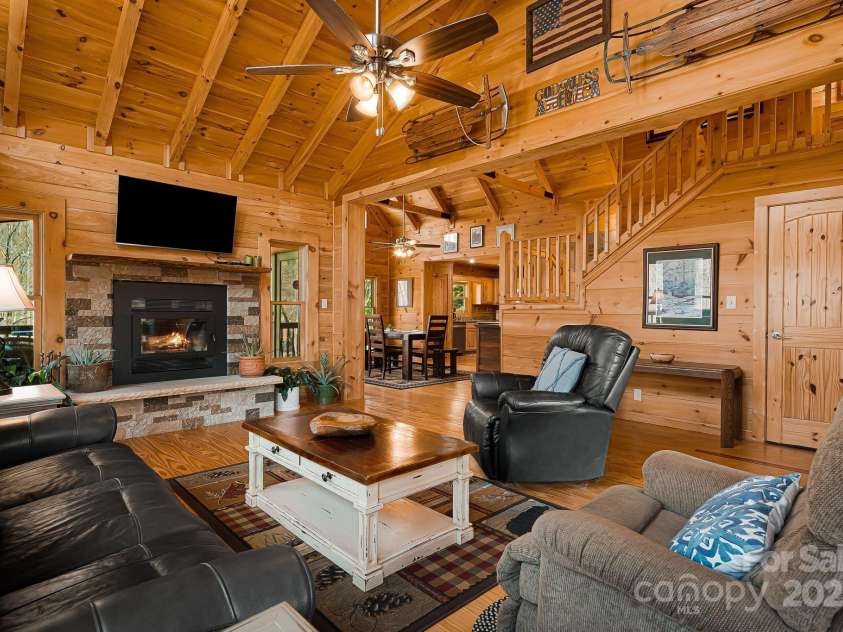 3695 Hwy 9 Highway, Mill Spring, NC 28756.  MLS# CAR4235096, YatesRealty ID 3700. Main Living room brings warmth by the fireplace