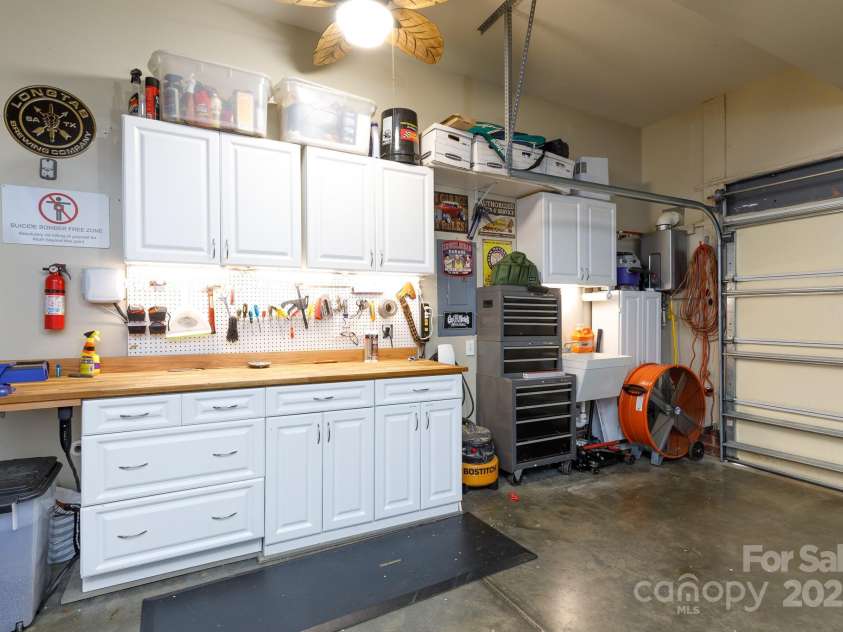 4232 Belle Meade Circle, Belmont, NC 28012.  MLS# CAR4238225, YatesRealty ID 3702. Garage workbench