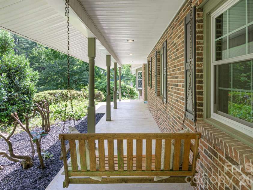 111 Kindy Forest Drive, Hendersonville, NC 28739.  MLS# CAR4398408, YatesRealty ID 37029. 45 Ft Covered Front Porch