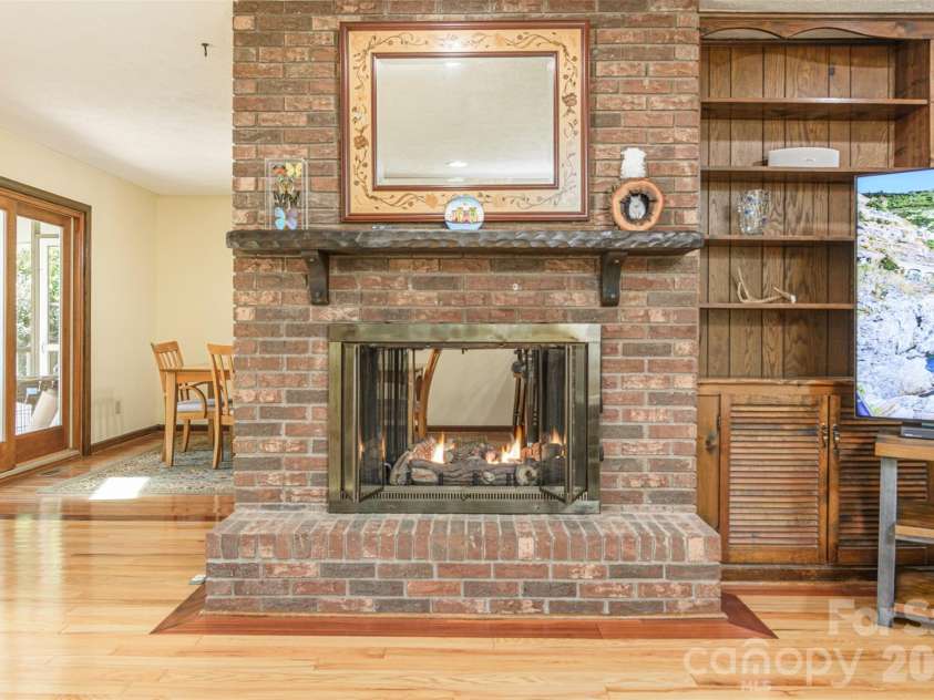 111 Kindy Forest Drive, Hendersonville, NC 28739.  MLS# CAR4398408, YatesRealty ID 37029. Double-Sided See-Through Fireplace