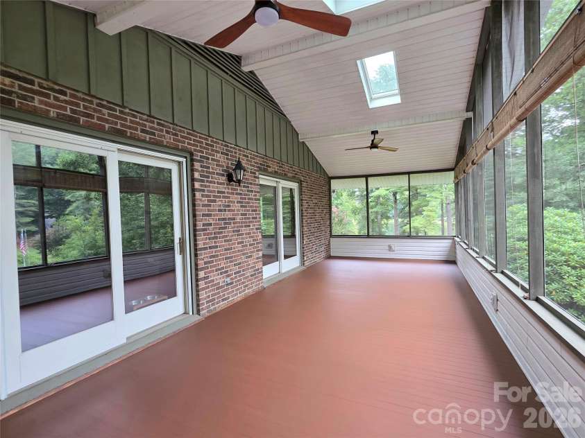111 Kindy Forest Drive, Hendersonville, NC 28739.  MLS# CAR4398408, YatesRealty ID 37029. Screened Porch Deck has been Recently Re-Finished.