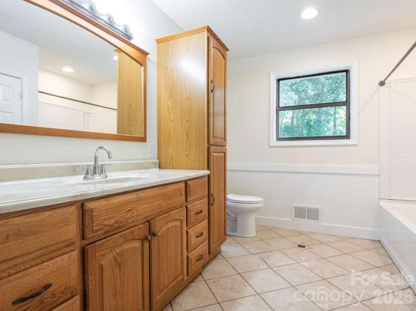 4531 Rocky River Road, Concord, NC 28027.  MLS# CAR4399344, YatesRealty ID 37030. Hall full bath with ceramic tile floors