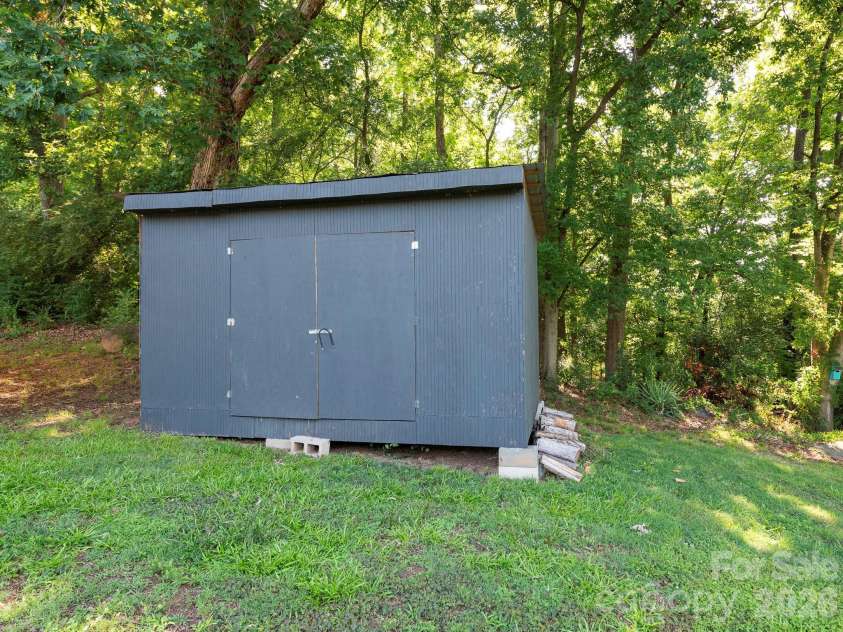 4531 Rocky River Road, Concord, NC 28027.  MLS# CAR4399344, YatesRealty ID 37030. Outbuilding w/metal roof