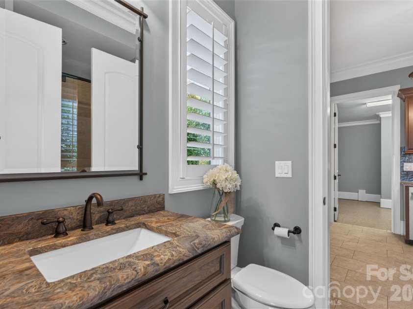 3225 Lake Pointe Drive, Belmont, NC 28012.  MLS# CAR4399291, YatesRealty ID 37031. Leathered granite countertops in guest bath