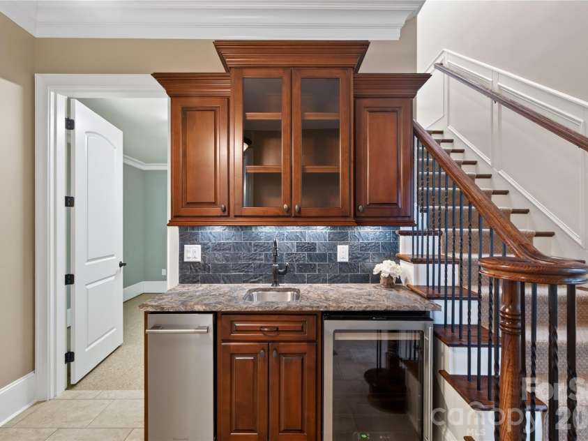 3225 Lake Pointe Drive, Belmont, NC 28012.  MLS# CAR4399291, YatesRealty ID 37031. Wet bar with leathered granite countertops and kitchen ice maker
