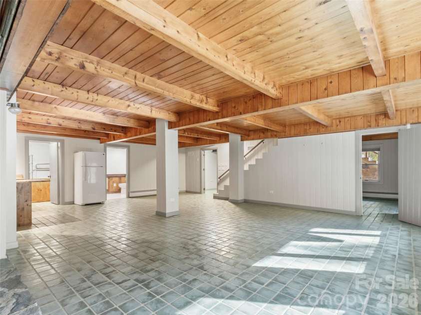 191 Fork Road, Burnsville, NC 28714.  MLS# CAR4355086, YatesRealty ID 37045. Main house basement