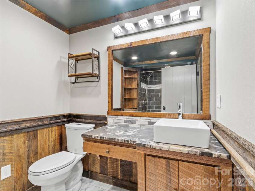 191 Fork Road, Burnsville, NC 28714.  MLS# CAR4355086, YatesRealty ID 37045. Main house bathroom in basement