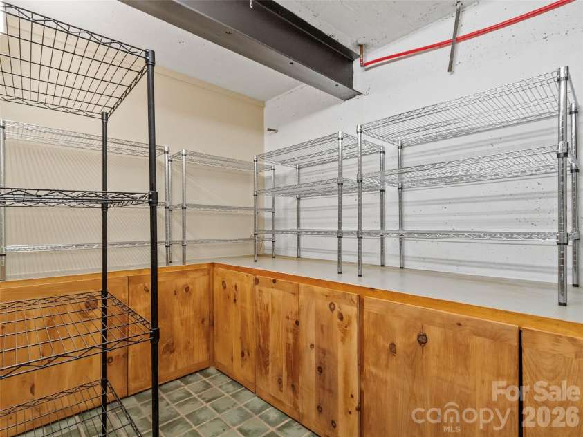 191 Fork Road, Burnsville, NC 28714.  MLS# CAR4355086, YatesRealty ID 37045. Pantry in main house basement