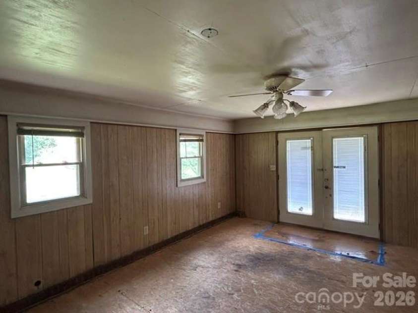 169 Double Island Road, Burnsville, NC 28714.  MLS# CAR4396716, YatesRealty ID 37060. Addition entry off front deck