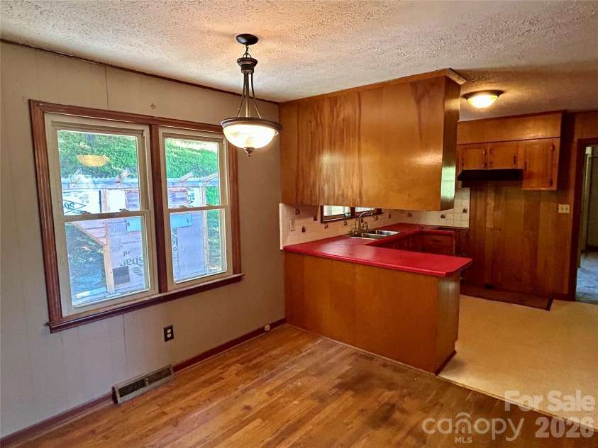 169 Double Island Road, Burnsville, NC 28714.  MLS# CAR4396716, YatesRealty ID 37060. Dining rm into Kitchen
