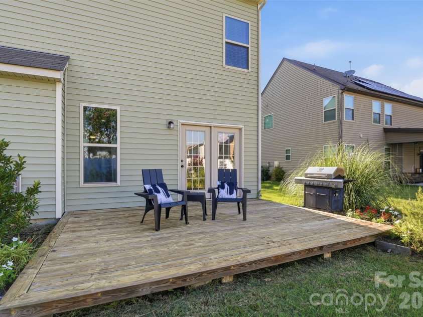 10022 Wrigley Drive, Charlotte, NC 28273.  MLS# CAR4400903, YatesRealty ID 37064. Back deck off doors from dining area